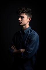 shot of a young man striking a pose against the studio background