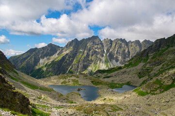View from the mountain Rysy of Veľké Žabie pleso and Malé Žabie pleso lakes. High Tatras. Border of Poland and Slovakia. Hiking in Slovakia. Beautiful landscape of mountain tops and the lakes.