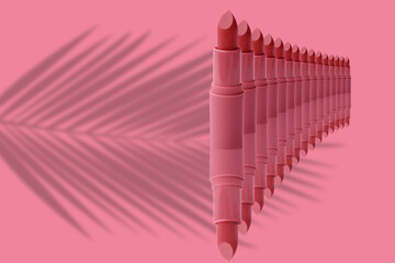 set of matte lipstick on delicate pink isolated background, red, peach color, beauty products close-up, concept of decorative cosmetics, makeup trends, lip care, beauty routine