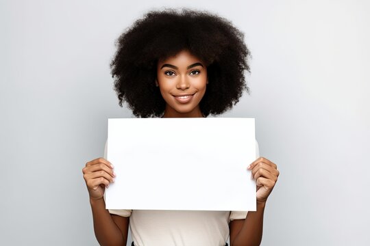 Beautiful young black woman holding a blank placard sign poster paper in her hands. Empty space for editing, ads, copy space. White background. Ai generative