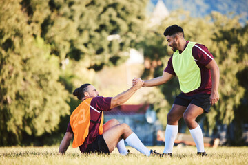 Rugby, teamwork and a sports man helping a friend while training together on a stadium field for fitness. Partnership, exercise and team building with an athlete and teammate outdoor for support
