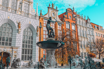 Neptune's Fountain, a famous historical landmark and colorful gothic houses in Gdansk, Poland, Europe. High quality photo © Shi 