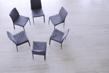 Chairs in a circle with copy space to use text for meeting concept, psychology consultation concept...