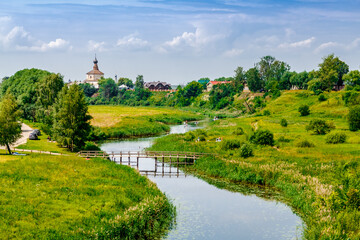 Picturesque summer view of the rural side of Suzdal and the river Kamenkal.The Golden Ring of Russia. 