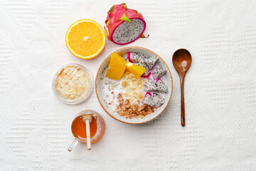 Bowls of oatmeal with mixed fruits topping