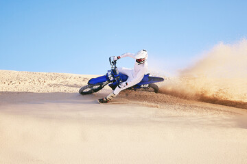 Bike, sand and sports with a man in the desert for adrenaline, adventure or training in nature....