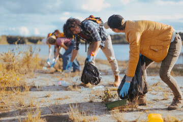 group of volunteer workers eco activists collecting garbage in a national park