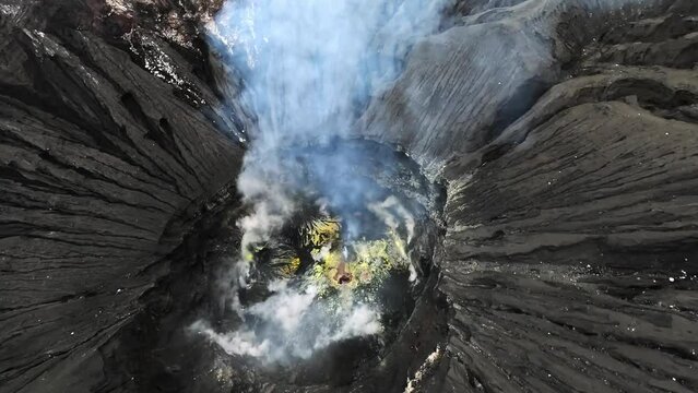 The mouth of a smoking volcano inside