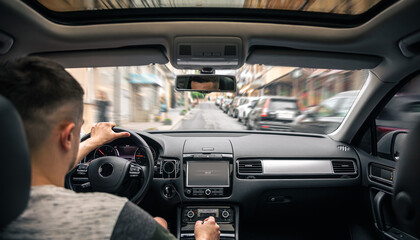 Hands on the wheel when driving at high speed from inside the car.