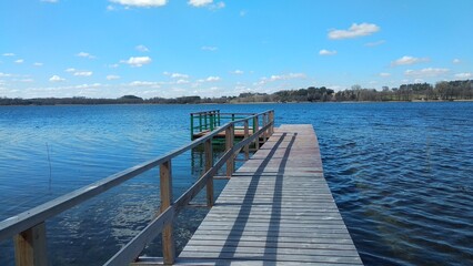 A wooden footbridge and a platform on a lake