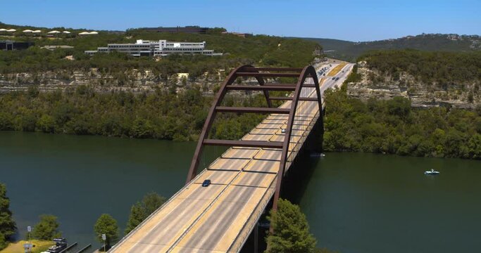 Establishing shot of the Pennybacker 360 Bridge over Lake Austin in Austin, Texas 