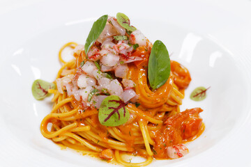 Italian food speciality, spaghetti seafood sauce with red prawns( gambero rosso) tartare