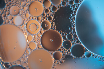 closeup photo of oil drops in watter