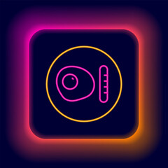 Glowing neon line Traditional british breakfast, fried eggs with sausage icon isolated on black background. Colorful outline concept. Vector