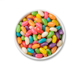 Colorful jelly beans in a bowl isolated over white background