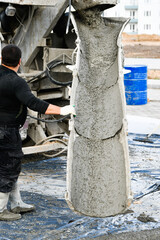 Concrete Pouring from Mixer – Construction Concept for House Building and Industry