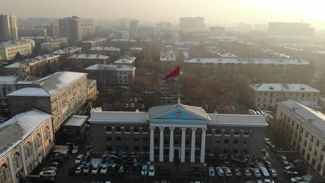 Kyrgystan flag in Bishkek city center. Aerial drone view. Flying over. High quality 4k footage