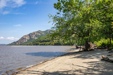 On the riverfront of the Hudson at Little Stony Point Park with a view of Breakneck Ridge.