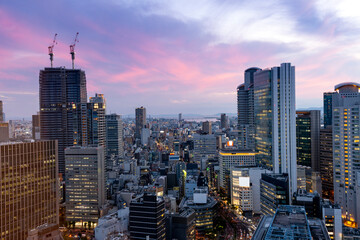 sunset or sun rise of  Osaka cityscape with Skyline and office building and downtown of Osaka with twilight sky in summer season