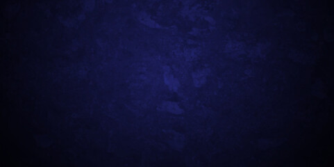 Dark Blue background with grunge backdrop texture, watercolor painted mottled blue backdrop background. concrete wall blue bright ink and watercolor textures on black paper background.