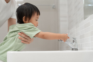 Save water. Little kid keeps turning off the running water in the bathroom to protect environment....