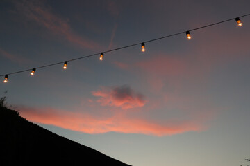 sunset with light bulbs - Powered by Adobe