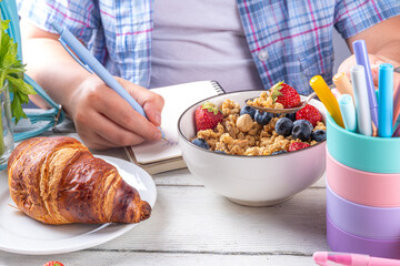 Healthy nutritious  morning breakfast for school kids, with fresh fruits, vegetables, croissant,...