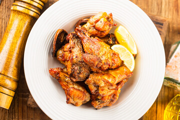 A plate of delicious lemon chicken wings