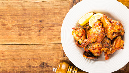 A plate of delicious lemon chicken wings