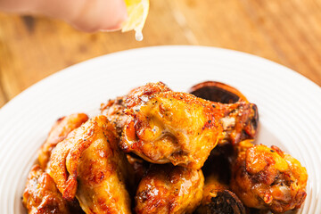 A plate of delicious lemon chicken wings