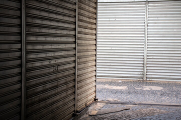 Metal roller shutter doors, in closed stores in popular shopping center in Brazil