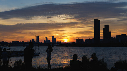 Red sunset and people of the Han River seen from Banpo Han river Park