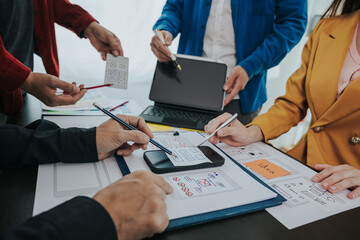 Developer team brainstorm creative teamwork plan, intimate mobile app developer team meeting on...