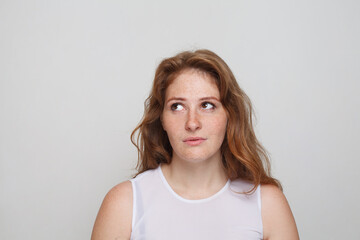 Portrait of pensive woman on white background