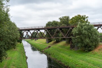 Wastewater system with crossing bridge of a canal n an industrial area