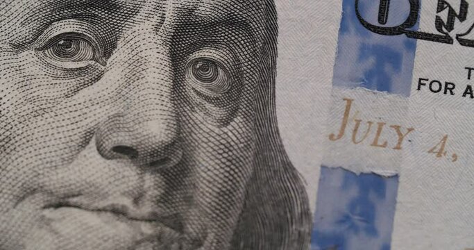 American one hundred dollar paper banknote in close up macro. Hundred USD cash macro view. Stop Motion of 100 USD Bills. Concept Finance Business Investment Success. Loop video. United States money.