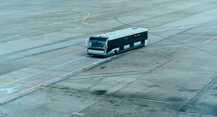 Airport shuttle bus on an airfield, airport travel scene - 632637122