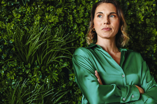 CEO of a responsible business: Executive woman standing in a green office