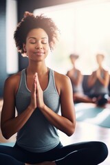 Fototapeta na wymiar shot of a young woman practicing yoga at a dance studio