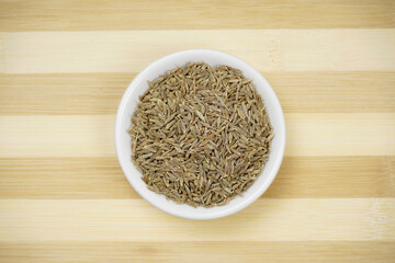 Top view of caraway seeds in bowl