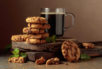 Chocolate cookies with mint and a cup of black coffee.