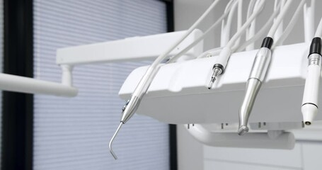 Modern Room with dental chair and medical equipment. Modern Dental office. Modern equipment at dental office. Dental clinic equipment.