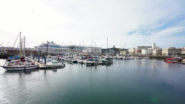View of spectacular Marina Real Harbour. Beautiful AIDA cruise docked in the bay. Yachts and fishing boats. Travel destination in Galicia, SPAIN. Stabilized.