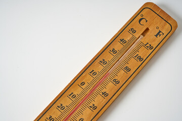 Classic wooden thermometer isolated on a white background