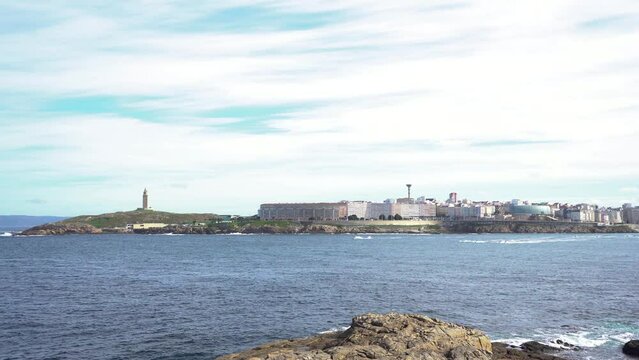 Beautiful A Coruna city. Situated in Galicia, Northwest of Spain. Travel destination. Panoramic view of the city. View of Riazor Beach and Orz&aacute;n beach. Travel destination. Camera pan right. Stabilized