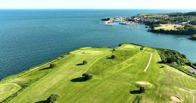 Fantastic golf course on a rocky bluff near the ocean 4k