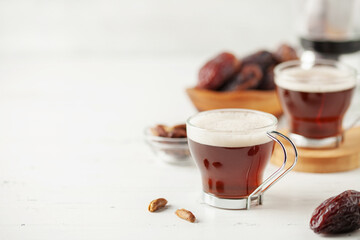 Cup with dates coffee  with date seeds. Healthy plant drink for immunity. Coffee alternatives. Copy space
