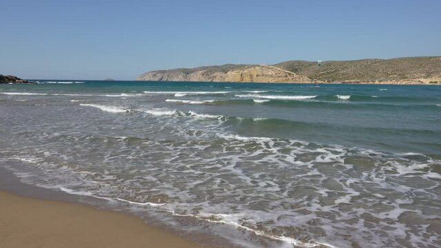 Prasonisi beach on the island of Rhodes is an isthmus with the Aegean Sea on one side and the Mediterranean on the other