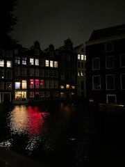 Fototapeta na wymiar Houses in the night, red light district, Amsterdam