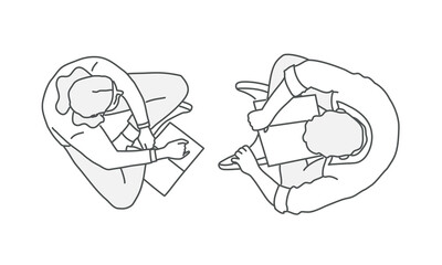 Couple sit opposite each other and talk